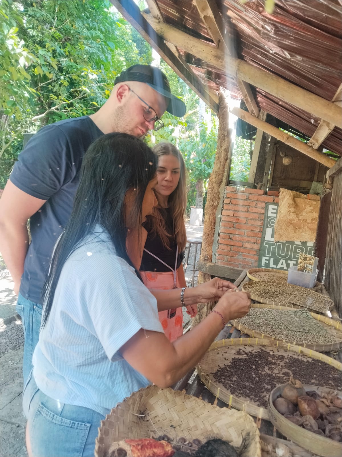Guide explaining Luwak coffee and spices to guests